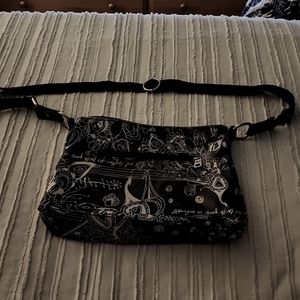 Beautiful EUC black and silver Sakroots purse
